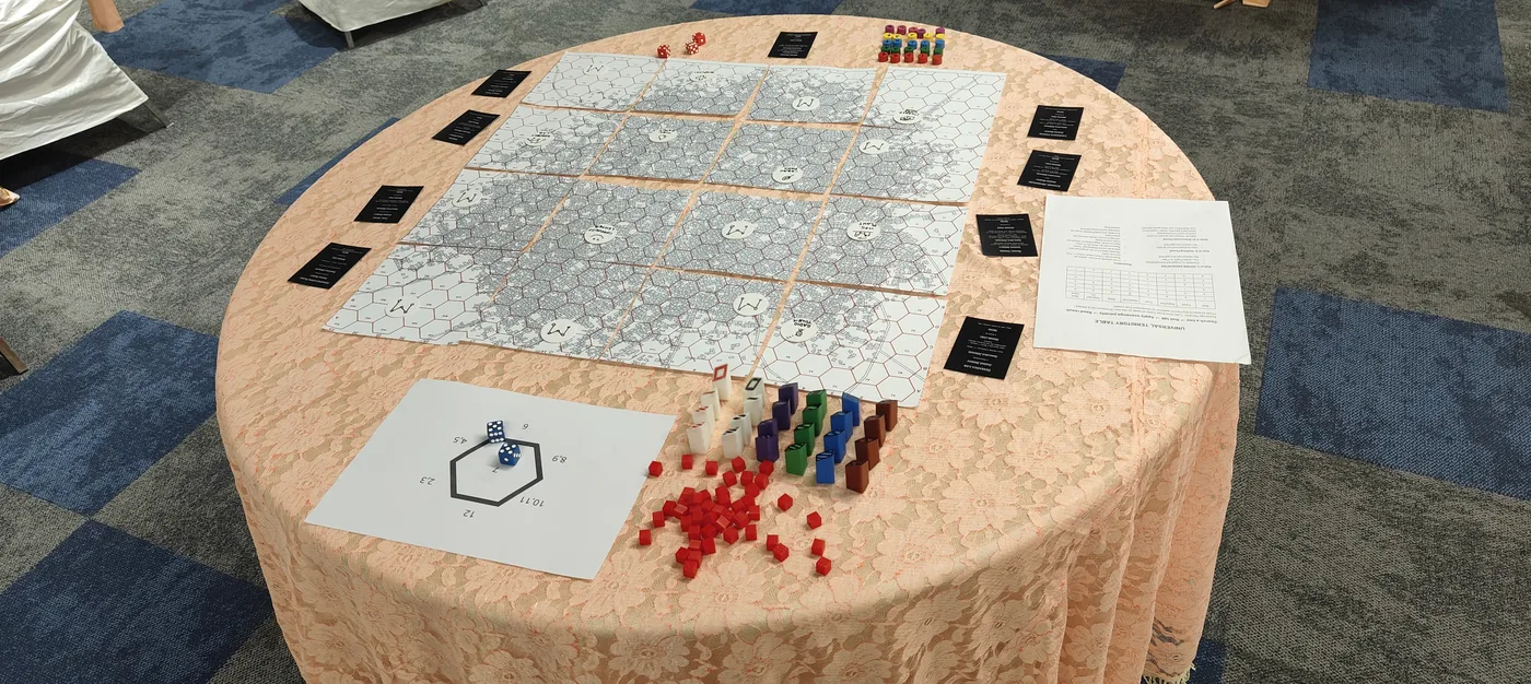 Welcome to Zombiepuram set up on the table - the printed hex map of the city with faction towers and resource cubes