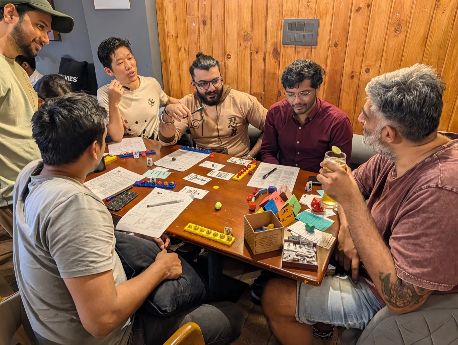 Team playing a tabletop strategy game during a training workshop