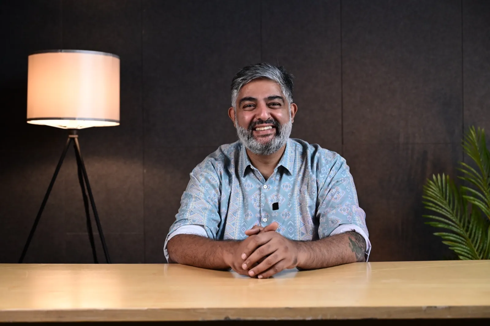 Portrait of a workshop facilitator speaking at a desk